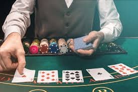Mobile phone displaying situs baru live dealer table with Piala Asia match odds sidebar